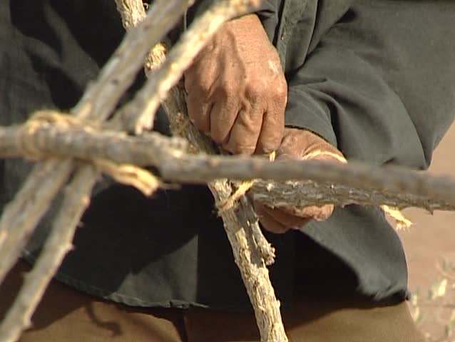 Native building a hut in Shark island