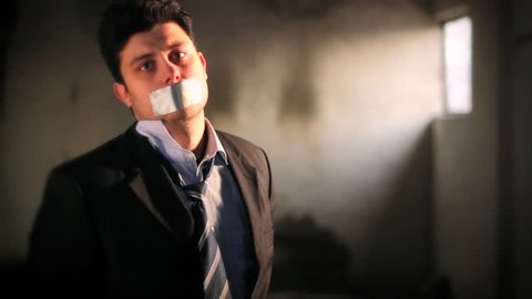 Businessman Hostage Tape over Mouth Tied Up Scared