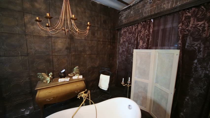 Decorated in a studio room with bath and chandelier