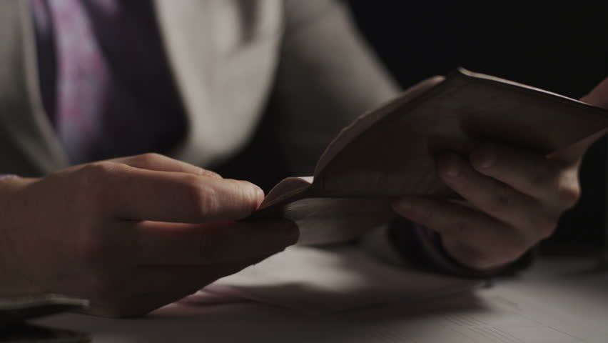 Security guard Man checks the passport control