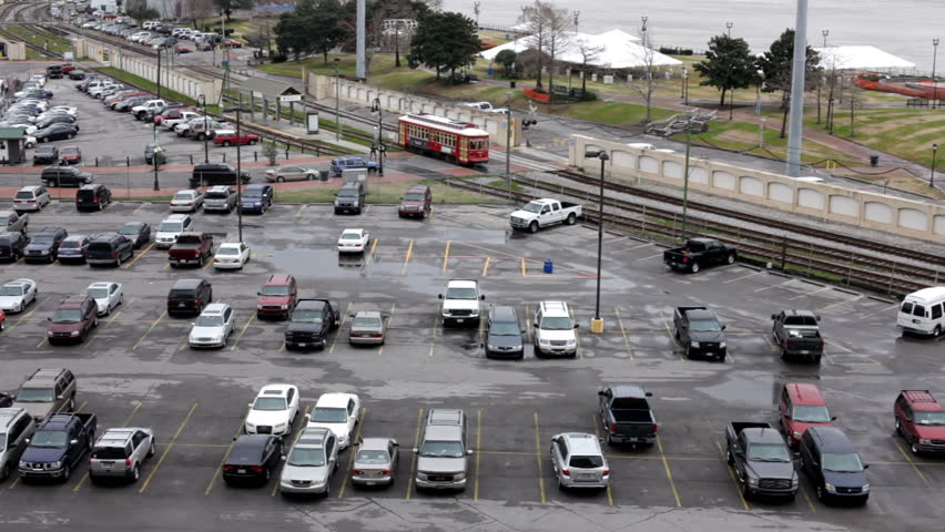 Street car going passed parking lot