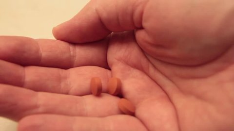 Pills, Medicine, Aspirin, Ibuprofen, Being Dropped into Hand from Bottle