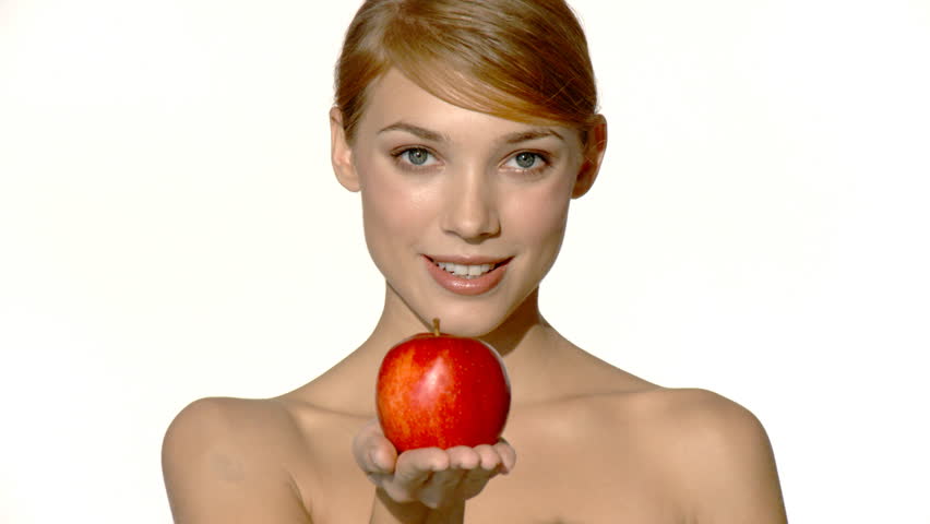 Portrait of beautiful and sexy woman holding red apple 