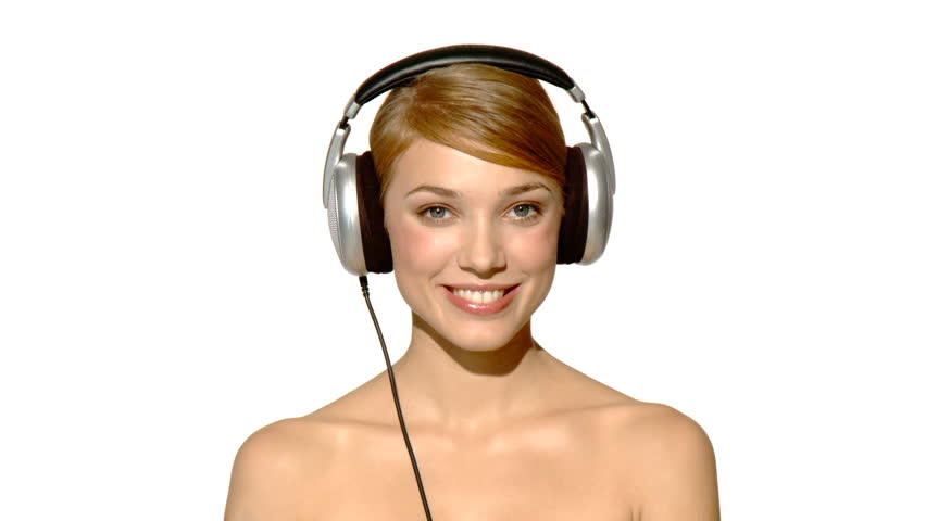 Portrait of beautiful and sexy woman dancing in headphones 