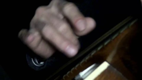 Playing guitar chords hand string