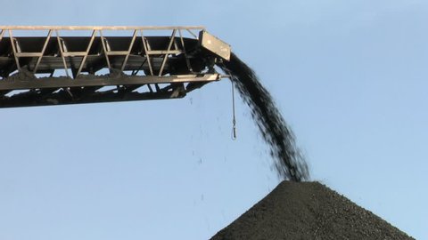 Coal being stockpiled by stacker