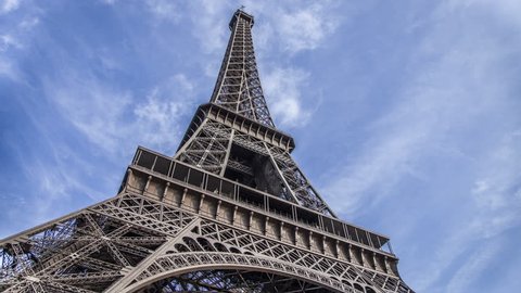 PARIS - CIRCA OCTOBER: Time lapse of The Eiffel Tower from day to night circa October 2012 in Paris. The Eiffel Tower is an iron lattice tower located on the Champ de Mars in Paris.
