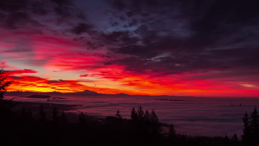Time lapse of Morning sky changing colour in Vancouver, BC. Fog covering most of the city