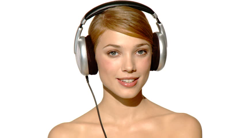 Sexy woman is listen to the music in headphones 