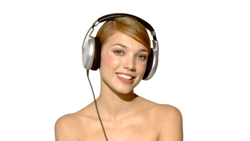 Portrait of beautiful and sexy woman dancing in headphones 