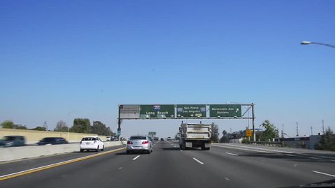 Driving POV through the 405 freeway in Los Angeles, California.
