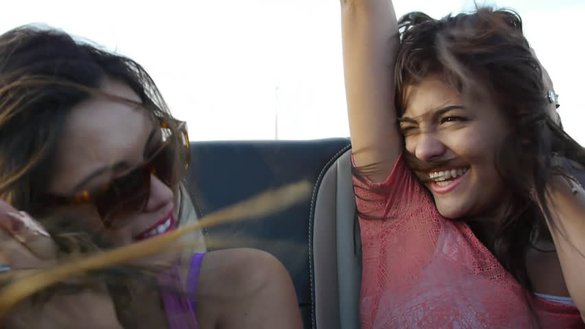 Two Friends Scream With Excitement In The Backseat Of A Convertible Royalty-Free Stock Footage #5734481