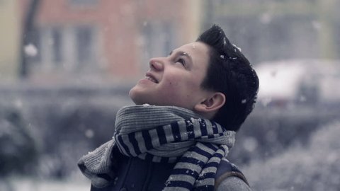 Young teenage boy enjoying snow, super slow motion, shot at 240fps
