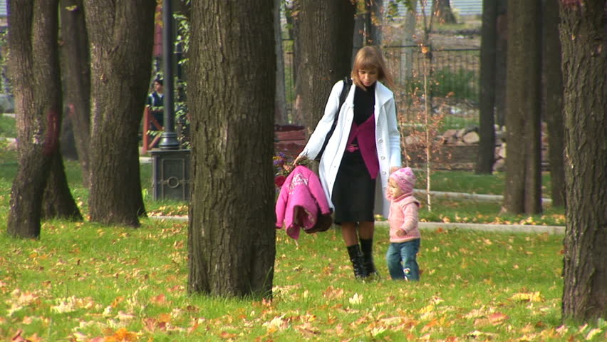 Mother and child on a walk in the park.