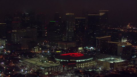 Houston Aerial Skyline. A stunning bird's eye view of Houston's towering skyline. The Toyota Center sits in the middle with its bright red rooftop logo.