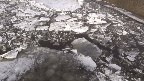 beginning of  ice drift on spring time  river: film stockowy