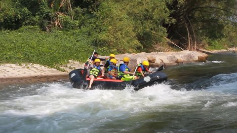 NAKHONAYOK, THAILAND - MARCH 1: White water rafting on the rapids of river Nakhonayok on March 1, 2014 in Nakhonayok , Thailand. Nakhonayok River is one of the most popular among rafters in Thailand. 