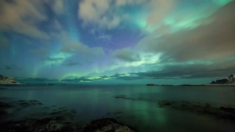 Northern lights (Aurora borealis) in Norway over a beach