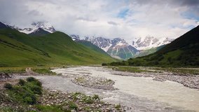 River in mountain valley at the foot of  Mt. Shkhara. Upper Svaneti, Georgia, Europe. Caucasus mountains. Beauty world. HD video clip (High Definition)
