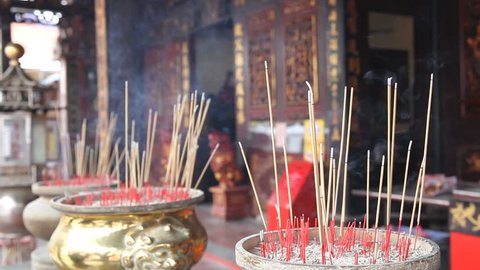 Burning Incense Joss Sticks for Blessings in Buddhist Temple 1920x1080