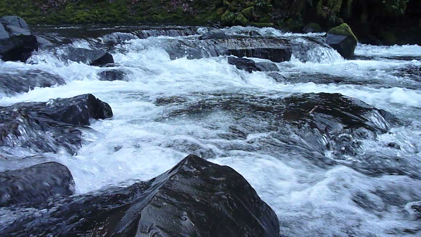 rushing-river-water-and-rocks-stock-footage-video-100-royalty-free