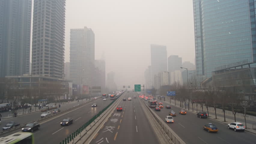 Beijing City Traffic. China's capital city of Beijing street traffic of automobiles, real time. Foggy winter day, smog, air pollution. February 22, 2014. Royalty-Free Stock Footage #5763557