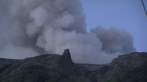 Smoking volcano on the coast