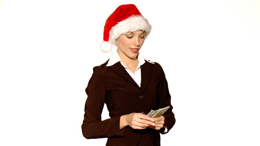 Businesswoman in santa hat giving you some cash 