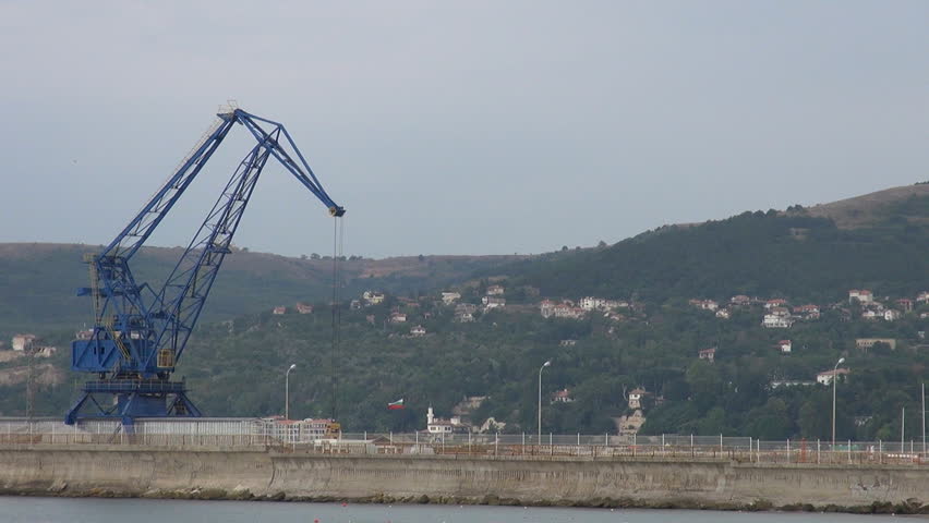 Timelapse of a crane working in port in Bulgaria dock, import export  business by day