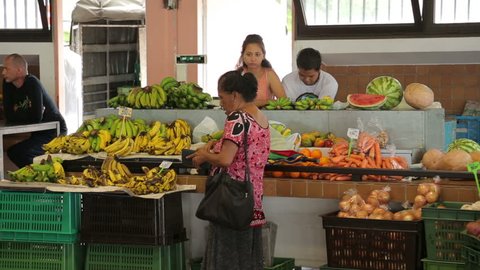 NOUMEA, GRANDE TERRE/NEW CALEDONIA - FEBRUARY 06, 2014: Unidentified people shopping in Noumea's the city market.