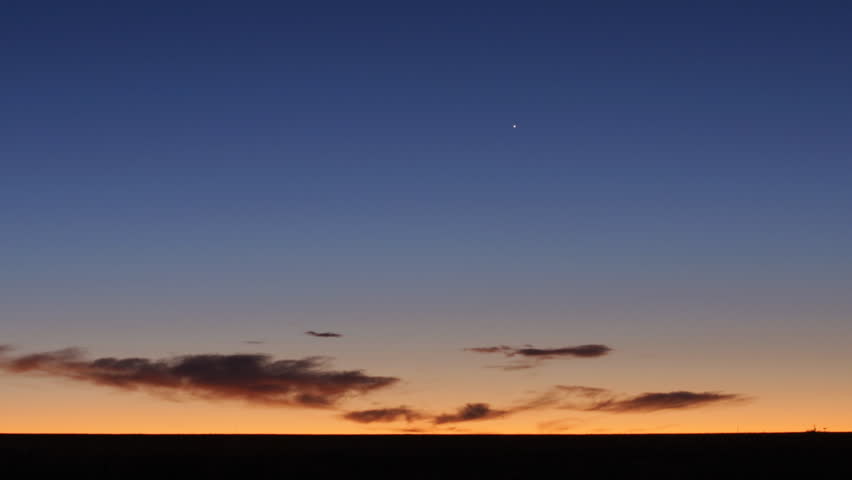 Time lapse of the brilliant orange and blue before sunrise in rural Colorado.