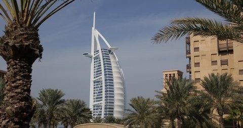 DUBAI, UNITED ARAB EMIRATES, UAE - JANUARY 20, 2014 Perfect Dubai Exotic Tourists Attraction Burj Al Arab Madinat Jumeirah Palm Tree ( Ultra High Definition, Ultra HD, UHD, 4K, 2160P, 4096x2160 )