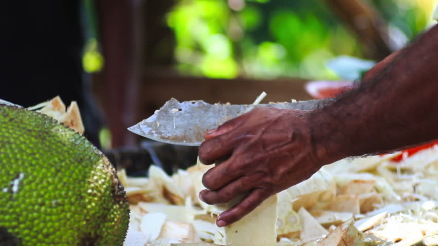 Sri Lanka man with a machete chop vegetables