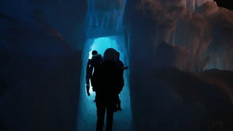 Families walking through ice caves
