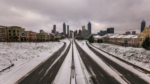 Atlanta cityscape time lapse after rare snow storm.