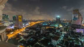 Panning Bangkok cityscape time lapse at night.