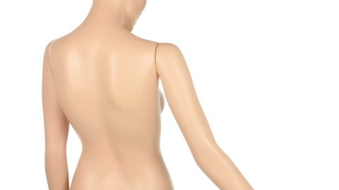 close up of a plastic mannequin turning on a turntable isolated on white background