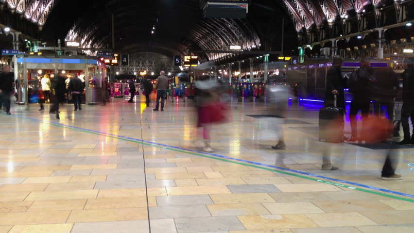 One of Britain's most famous train stations filmed in time lapse. Commuters and travellers on their way home from Paddington on a Friday evening in London. Royalty-Free Stock Footage #5783246