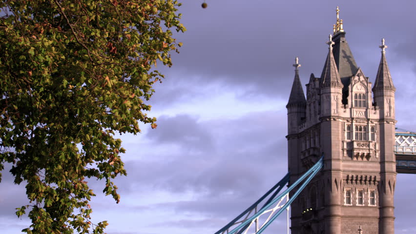 Panning view of tops of towers on Tower Bridge in London, England