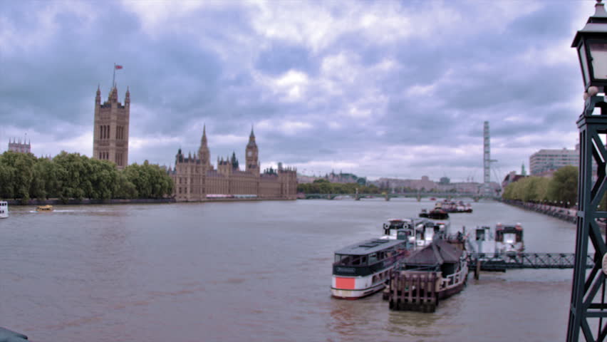 Traveling view of Westminster palace from across River Thames in London, England