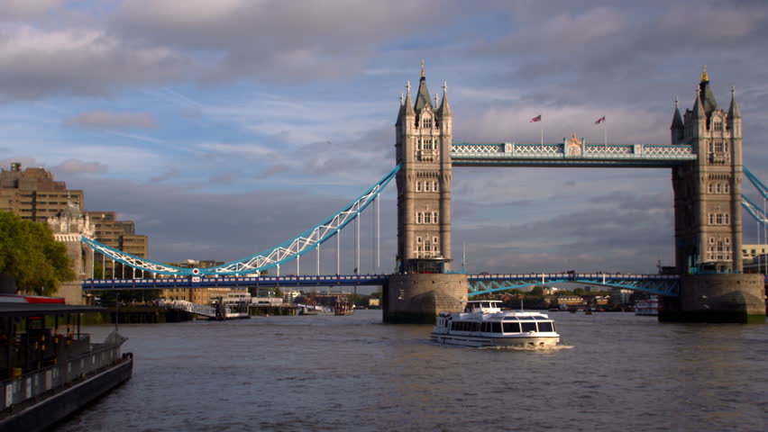Boat in front of Tower Bridge on River Thames in London, England