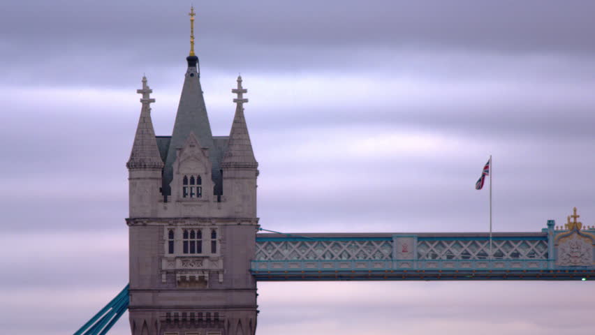 Tower of Tower Bridge and British flag