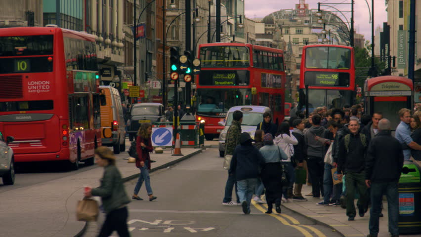 LONDON, UK - OCTOBER 8, 2011: Cars, people and double-deckers in slow motion.