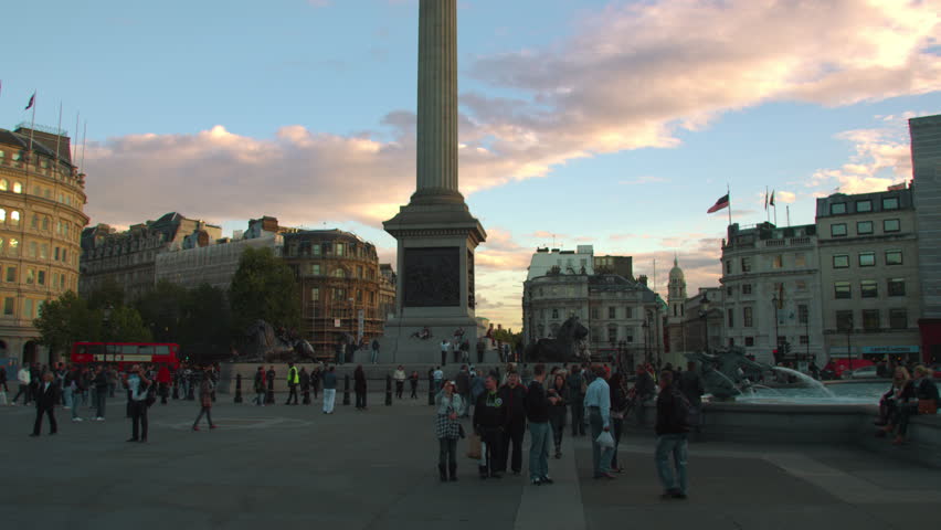 LONDON, UK - OCTOBER 7, 2011: Tourists near Nelson's Column in Trafalgar Square
