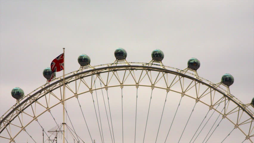 LONDON, UK - OCTOBER 8, 2011: London Eye capsules and British flag.