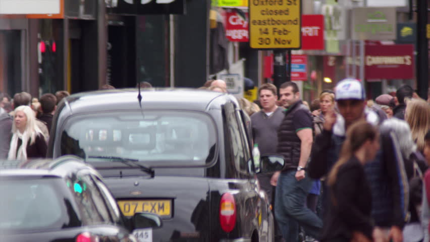 LONDON, UK - OCTOBER 8, 2011: People and traffic in slow motion.