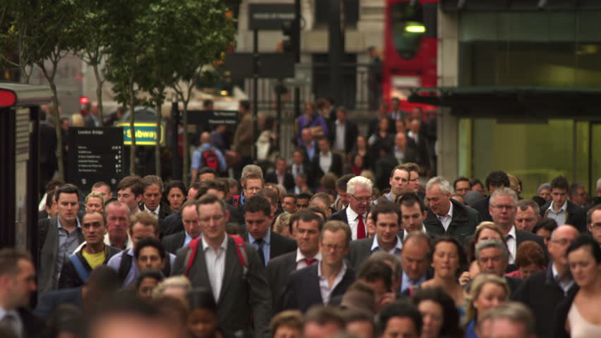 LONDON, UK - OCTOBER 10, 2011: Busy street filled with commuters.