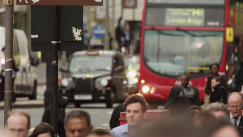 LONDON, UK - OCTOBER 10, 2011: Double-decker stops on a busy street.