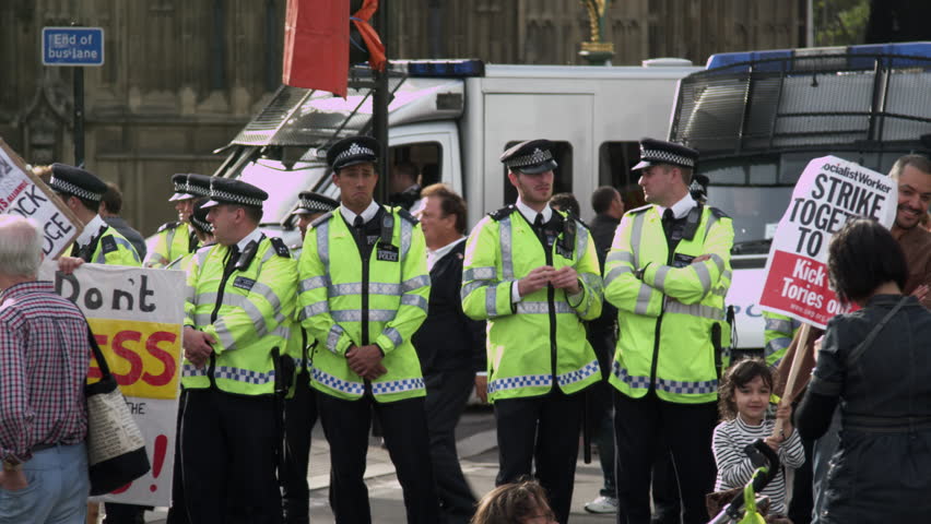 LONDON, UK - OCTOBER 9, 2011: Unidentified policemen and protesters near