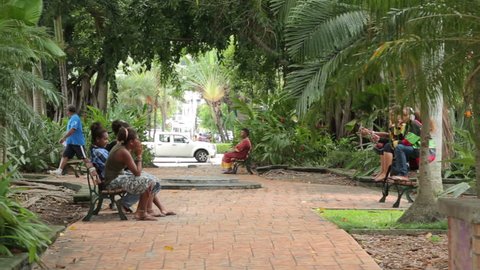 NOUMEA, GRANDE TERRE/NEW CALEDONIA - FEBRUARY 06, 2014: Pan of local people in city park. The Kanaks are the indigenous Melanesian inhabitants of New Caledonia who want independence from French rule.
